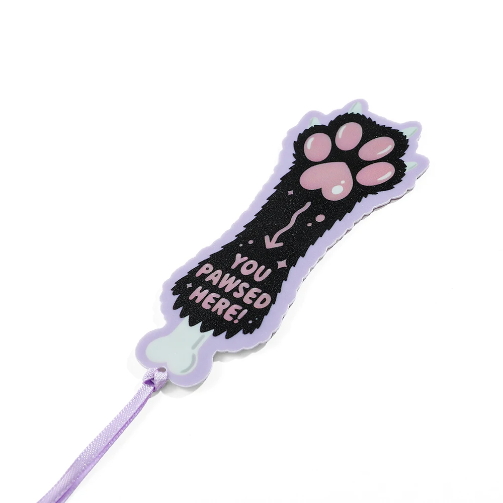 Cute cartoon purple ribbon bookmark with dog paw and cat paw printed on it, an ideal reading gift for dog cat bookworms