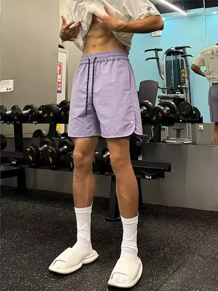 

Quick Dry Sport Shorts Men Summer Thin Ice Silk Training Casual Five-Quarter Length Fashionable American Fitness Brand