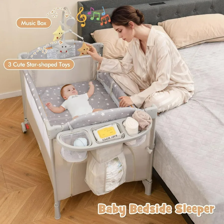 Pack and Play with Bassinet 5in1 Baby Bedside Sleeper w Diaper Changing Table Storage Bag Toy Arch Music Box Detachable Side Ra