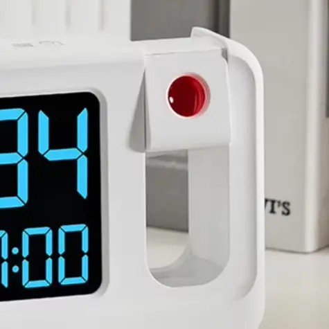 

180 Rotating Projection LCD Alarm Clock Black And White Options Versatile Projection Features Alarm Settings White