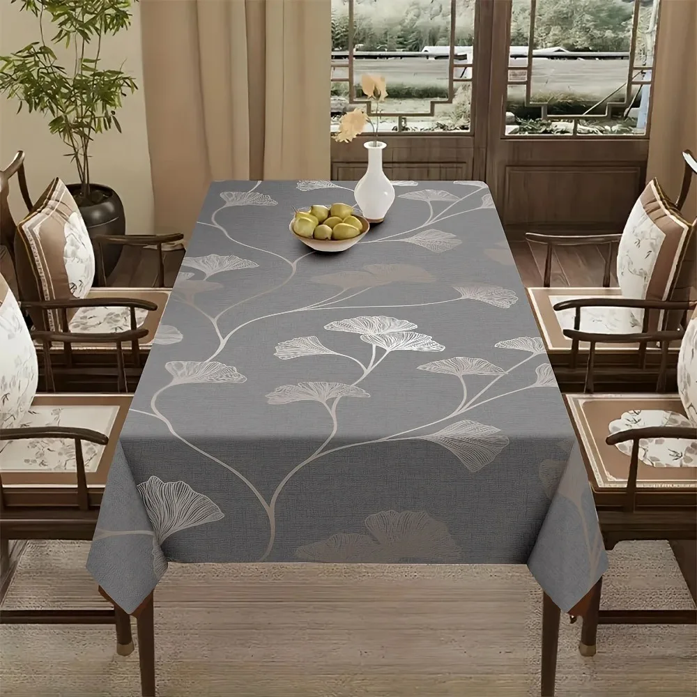 One polyester fabric tablecloth with a grey ginkgo leaf pattern, elegant and easy to clean.