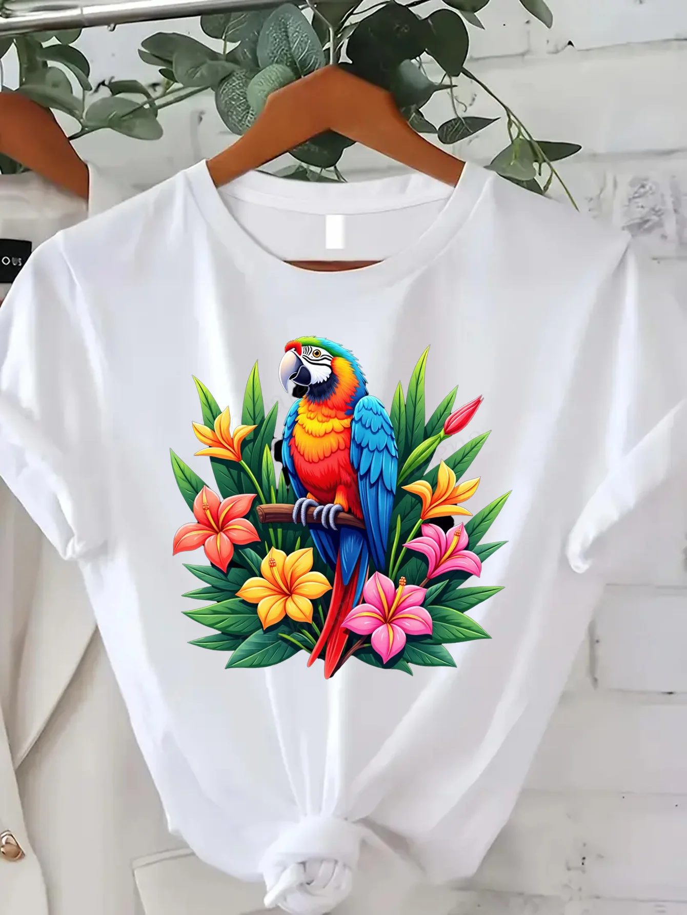 Women's Loose T-Shirt - Black Background with Tropical Parrot and Floral Print T-Shirt - Soft and Breathable Round-Neck Top - Loose Fit Vacation Shirt, Suitable for Women - Everyday Summer Wear and Beach Party Attire