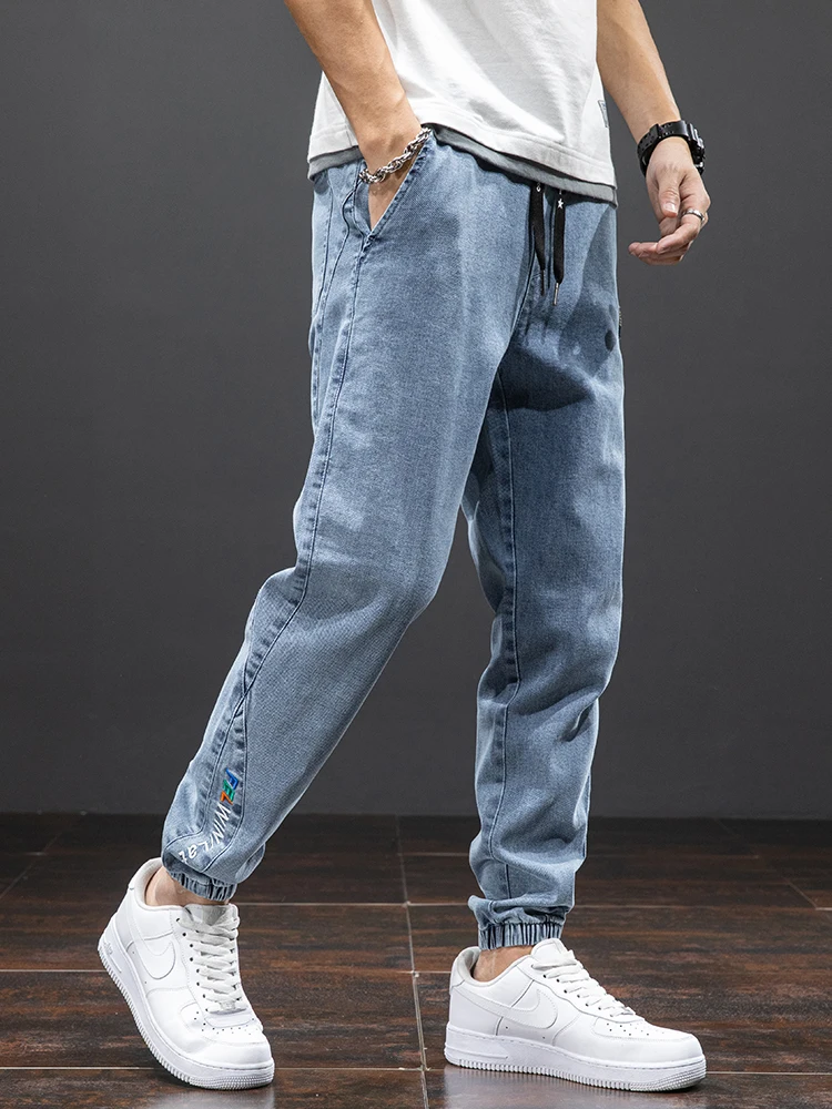 Wiosna lato czarne niebieskie dżinsy Cargo mężczyźni Streetwear Denim spodnie do biegania mężczyźni Baggy Harem Jean spodnie Plus rozmiar 6XL 7XL 8XL