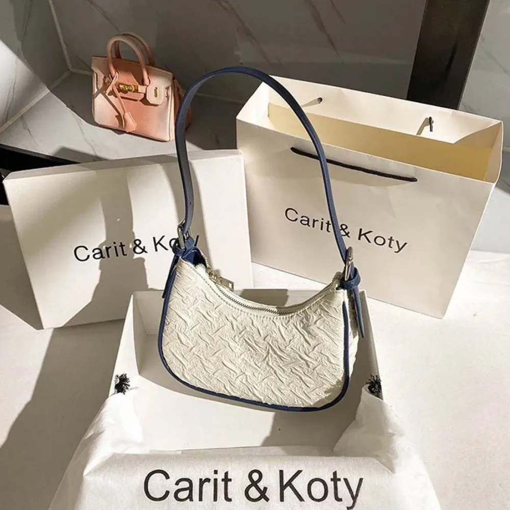 Original design advanced sense this year's popular pleated bag female summer niche design crescent bag underarm bag shoulder