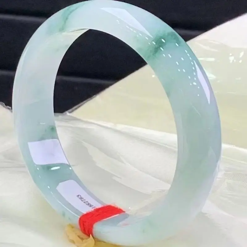 High-quality Burmese jadeite bracelet a perfect piece with a smooth lustrous texture and a delicate flowing floral pattern