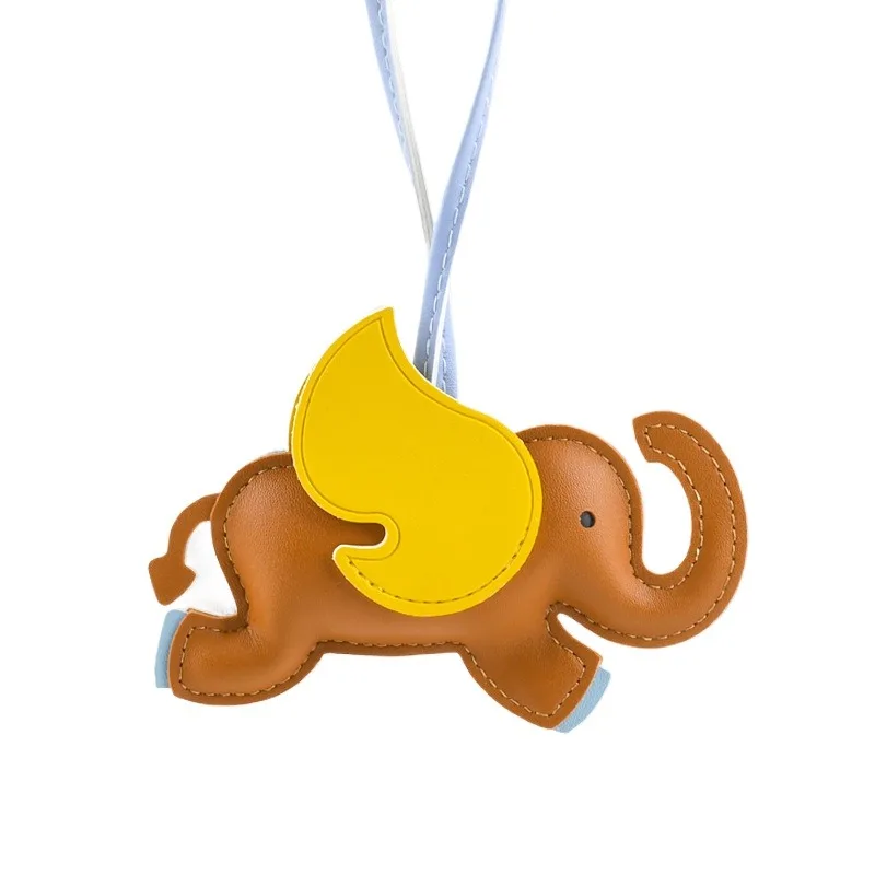 พวงกุญแจหนังรูปช้างมาสคอตห้อยกระเป๋าดีไซเนอร์ พวงกุญแจรถยนต์สุดสร้างสรรค์ ช้างน้อยน่ารักบินได้ ของขวัญคริสต์มาส จี้ห้อยกระเป๋า