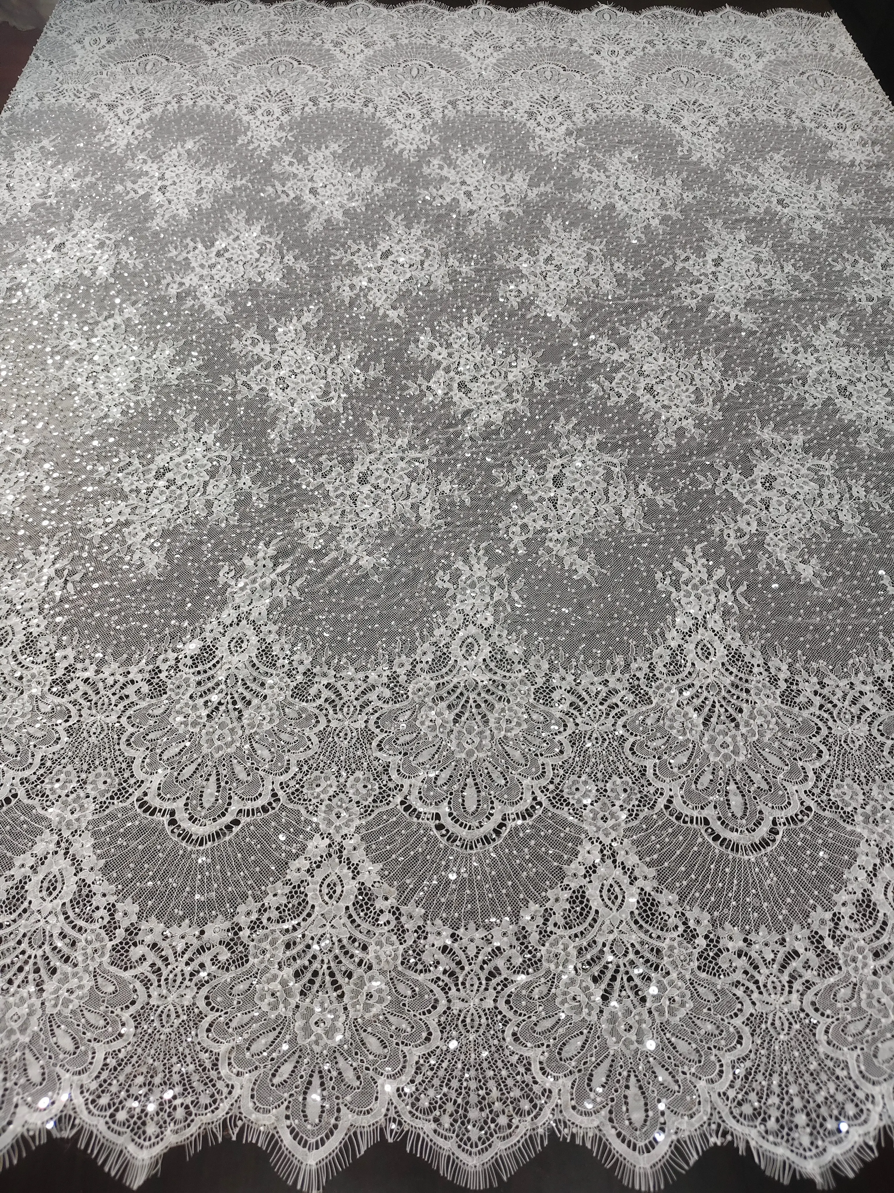 Luxurious Ivory Beaded and Sequined Lace Fabric, Dazzling Embroidered Floral Tulle, with Ruffled Eyelash Trim.