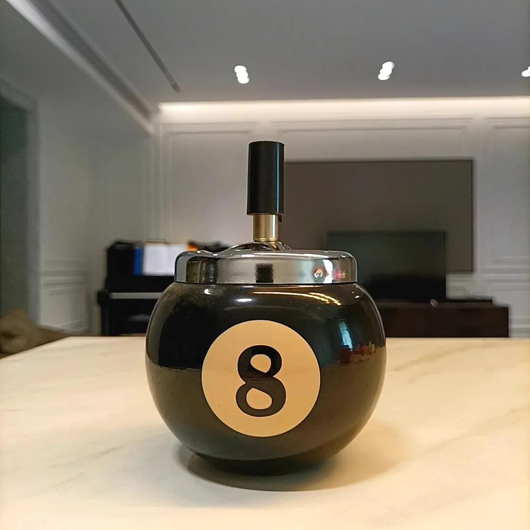 Creative, fashionable, and personalized ashtray with a metal windproof billiard ball shaped cover