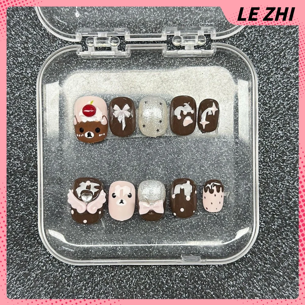 Dulce fresco hecho a mano elipse corta prensa en uñas dibujos animados Rilakkuma estrella brillante diamante Bowknot alas notas musicales uñas postizas