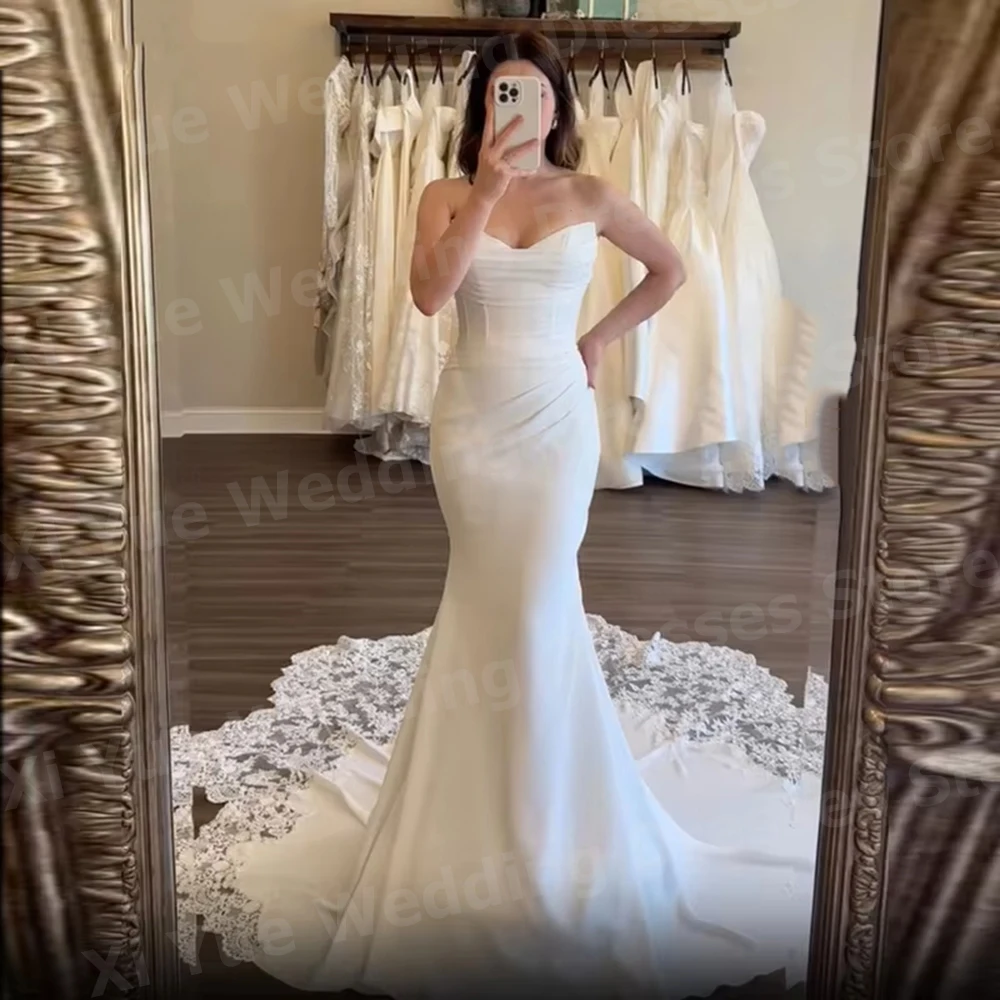 Eleganckie suknie ślubne w stylu syreny z koronkowymi aplikacjami, suknie ślubne bez pleców, suknie dla panny młodej szyte na miarę, dekolt w serek, suknia ślubna.