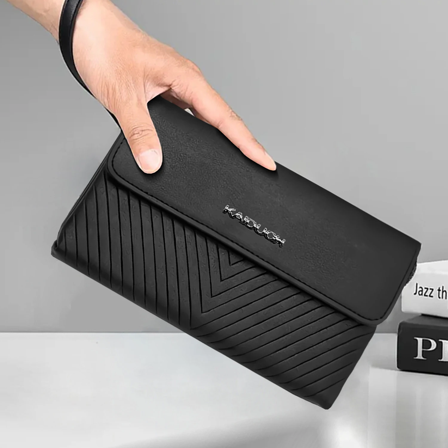 

Стильная мужская сумка-клатч черного цвета с текстурной поверхностью, с карманом на молнии, для безопасного хранения телефона, кошелька, карт и наличных в путешествиях