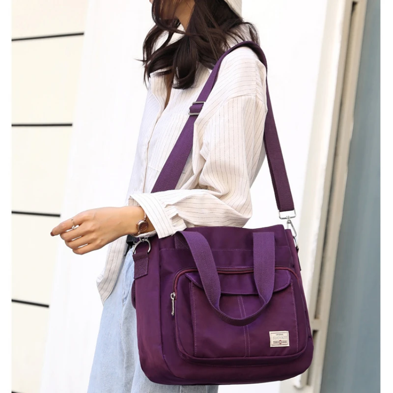 Spring New Canvas Handbag Lightweight Wear Resistant Waterproof Crossbody Bag Fashion Capacity Multi layered Design Women Bag