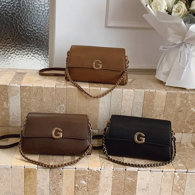 

Элегантная дизайнерская сумка для подгузников в минималистичном стиле для женщин, роскошная кожаная сумка-тоут с большой вместимостью, стильная сумка через плечо.