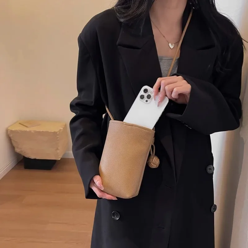 Versatile artistic small fresh small round ball pendant crossbody phone bag, soft leather cute mini bag for women view 2