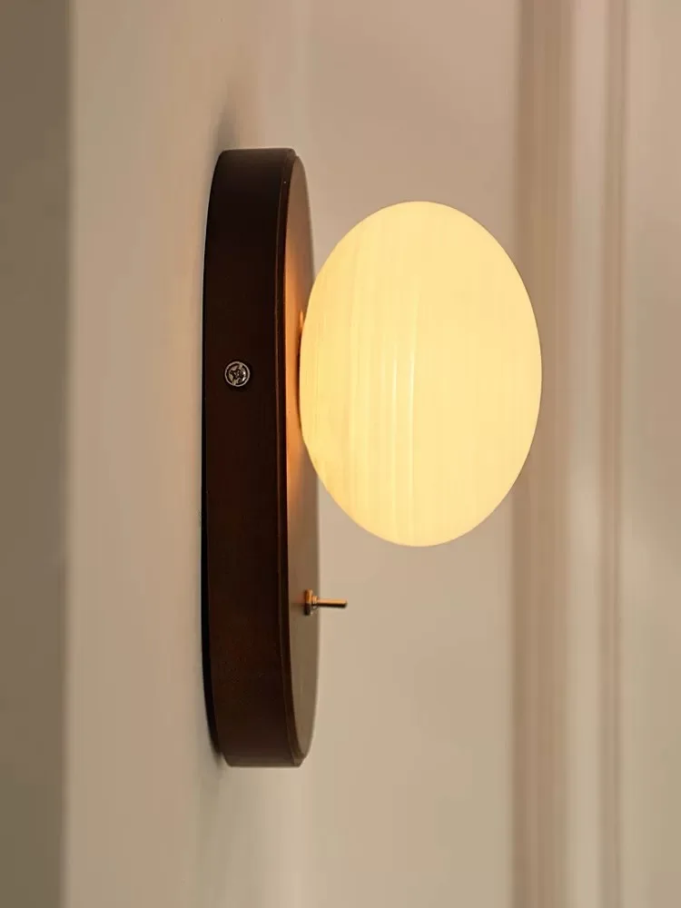 

Vintage snail wall lamp: bedroom, corridor. Wabi-sabi, French vibe. Snail shade, warm light. Elegant, cozy.