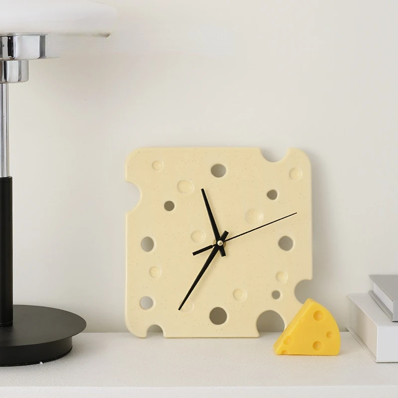 

Cheese shaped ceramic wall clock Silent creative personality Simple living room Bedroom decorative clock