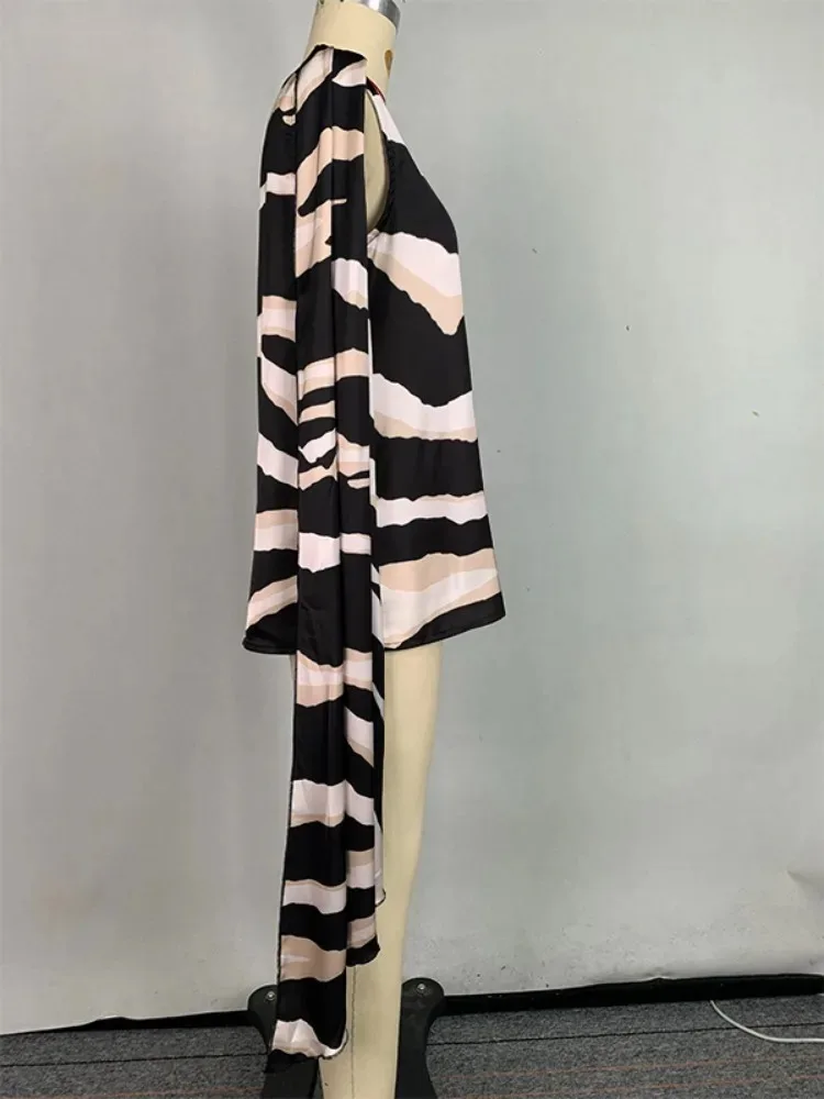 سترة علوية فضفاضة بدون أكمام مطبوعة بحاشية غير متماثلة جديدة لعام 2025 لحفلات الشاطئ ملابس غير رسمية ملابس علوية نسائية على الموضة