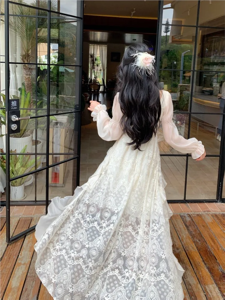 A long-sleeved floral dress with irregular ruffles in design
