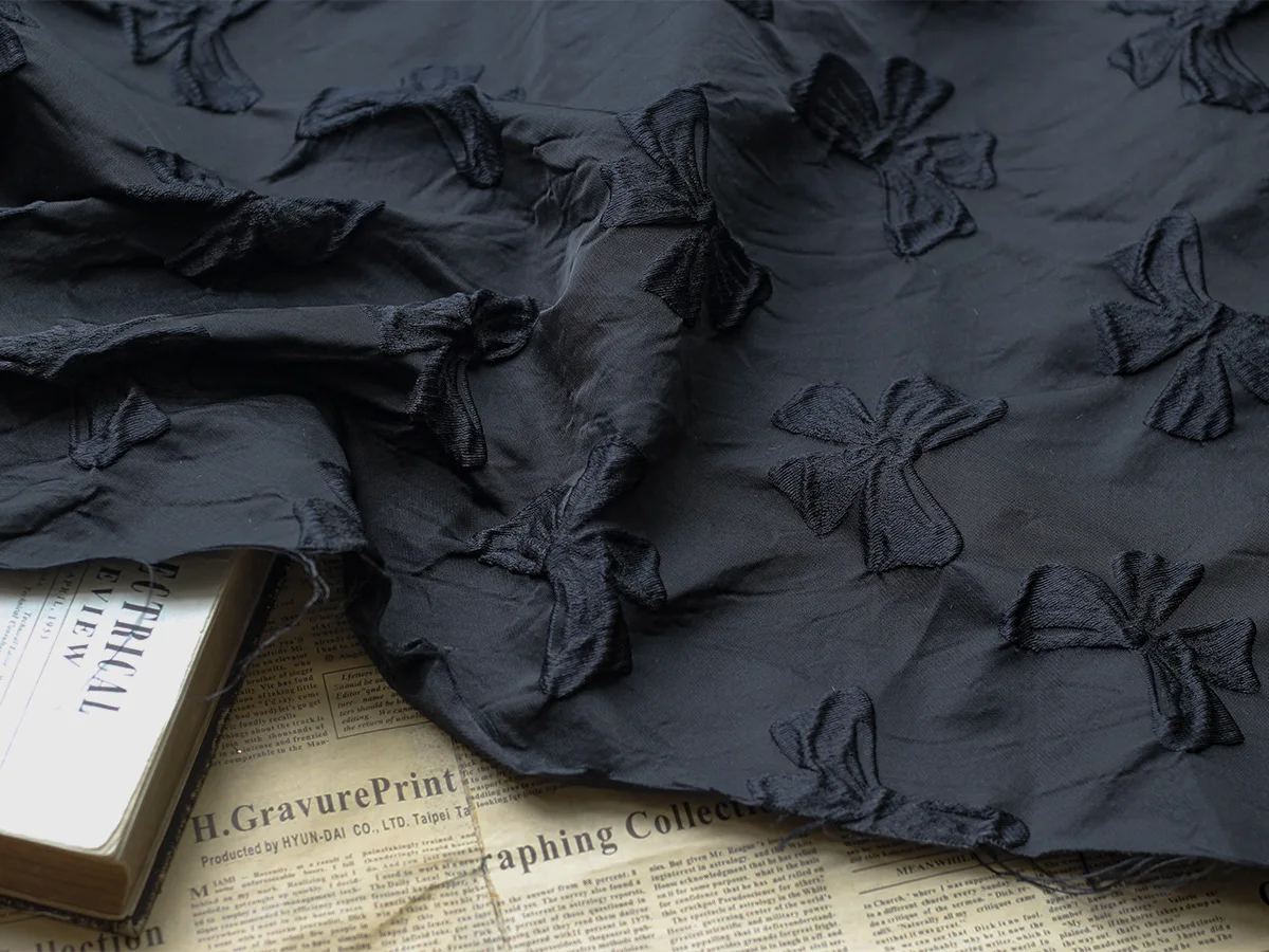 Yarn Dyed Embossed Black Bow Jacquard Fabric Stiff Polyester Autumn and Winter Jacquard Dress Fabric 45cmx140cm