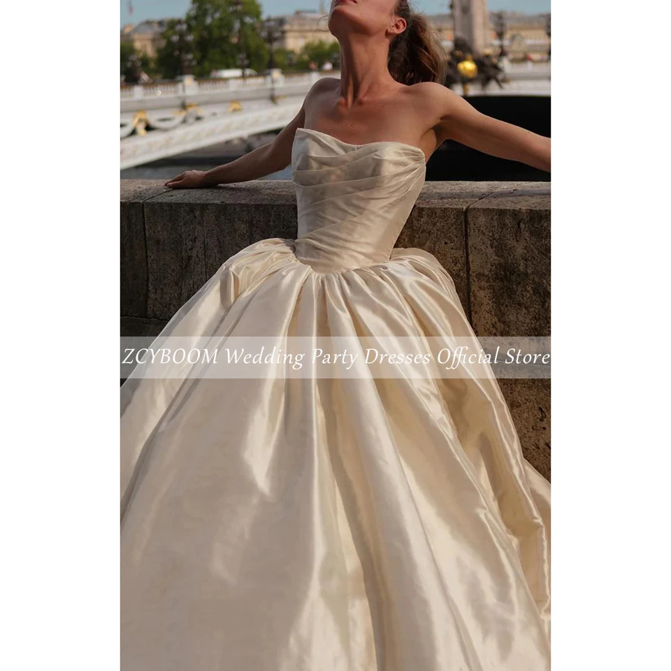 Elegancka suknia ślubna bez ramiączek i pleców w kolorze szampana na zamówienie, suknia balowa do ziemi z trenem zamiatającym, zapinana na zamek błyskawiczny, kolekcja 2025.