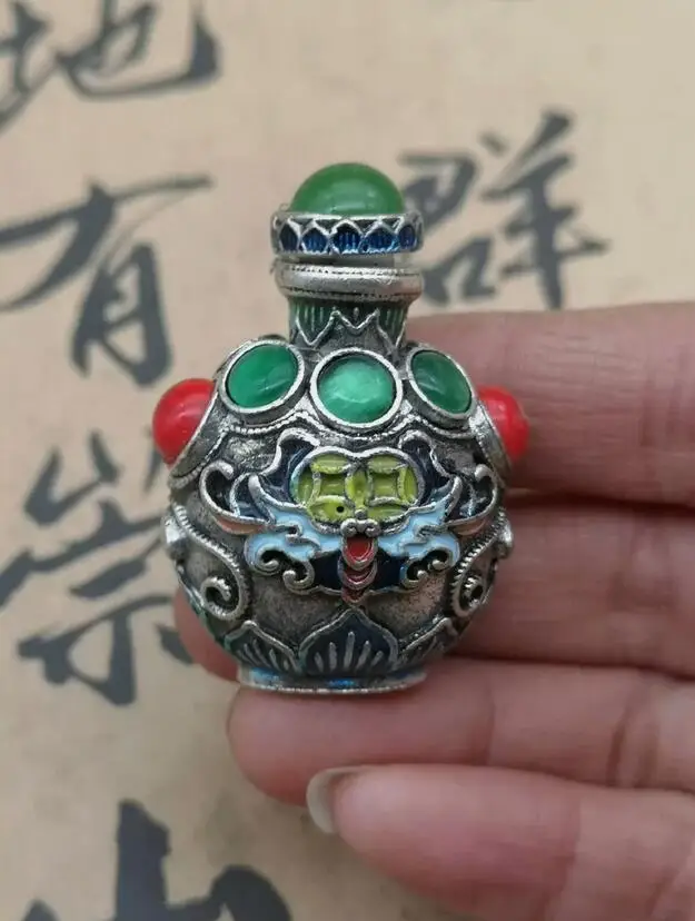 

An Exquisite Chinese Copper and Enamel Cicada Snuff Bottle