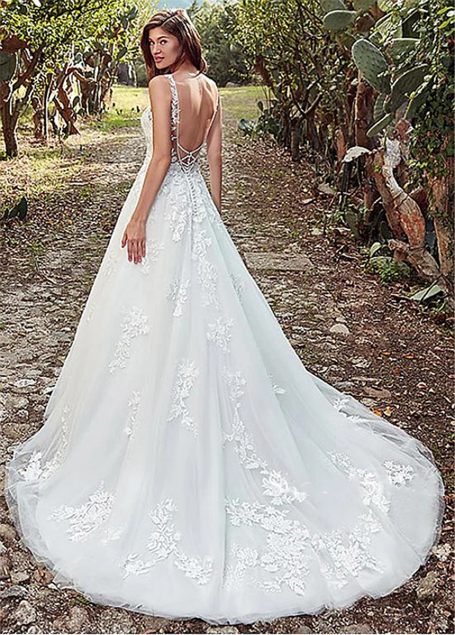 Vestido de novia de línea a con escote de Joya de tul, con apliques de encaje y abalorios, espalda abierta