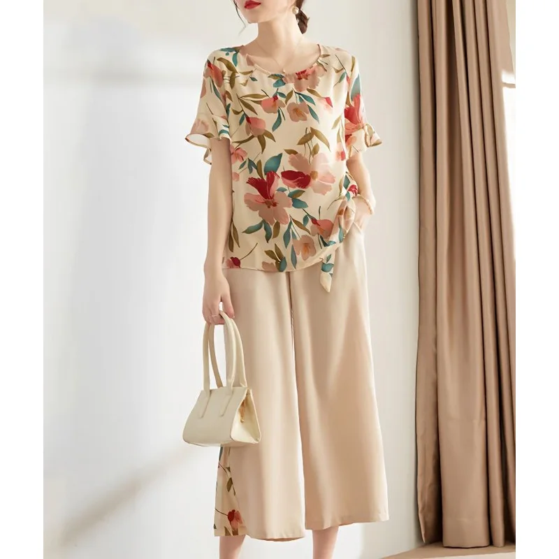 

2024 Summer Fashionable Round Neck Printed Short Sleeved Chiffon Shirt High Waist Pocket Loose Casual Cropped Pants Women's Set