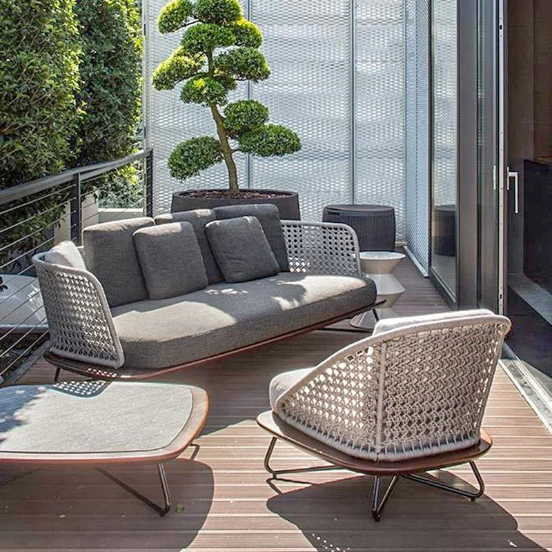 Nordic outdoor designer balconies, solid wood coffee tables, rattan woven single person sofas, courtyard leisure tables,