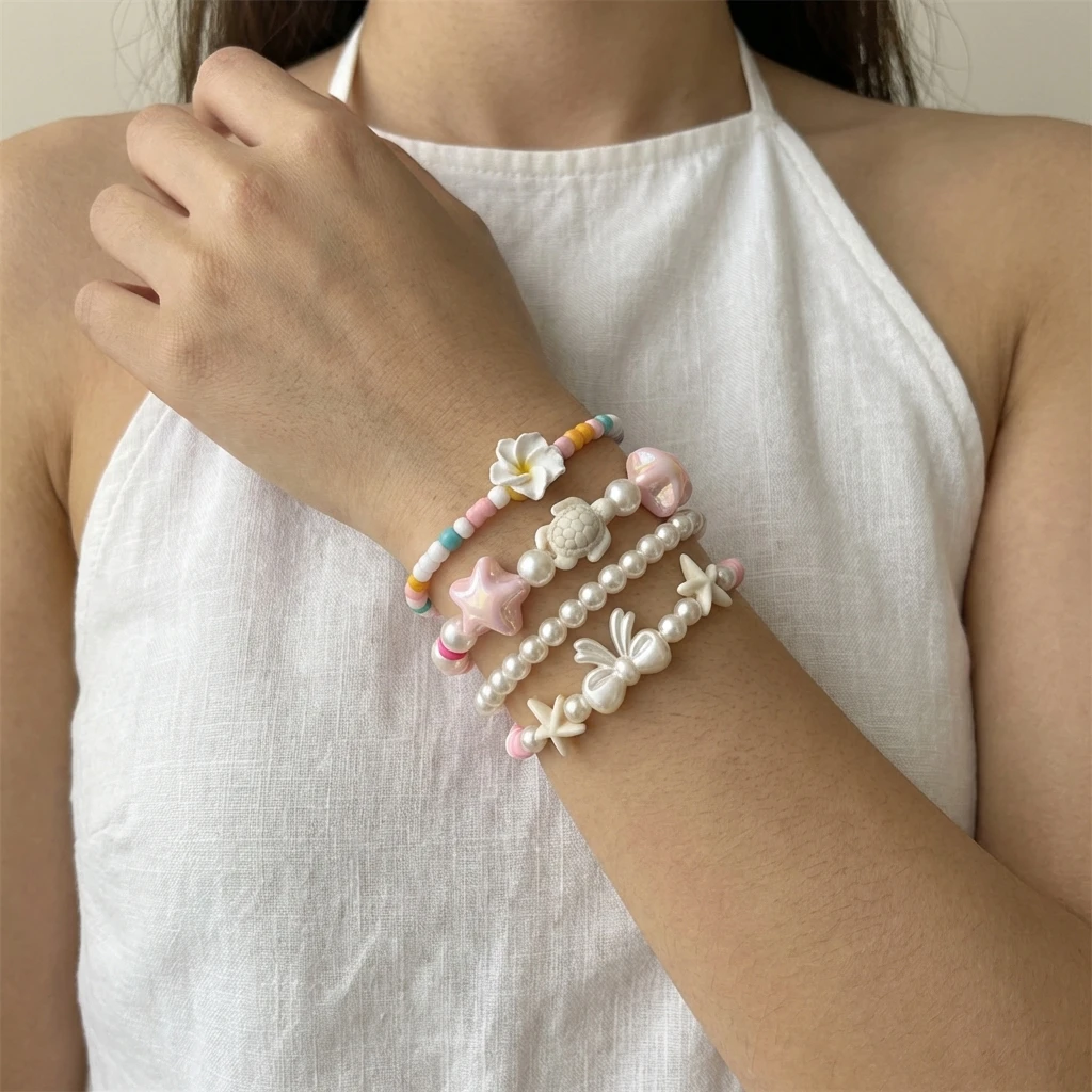 

4Pcs/Set Boho Flower Starfish Layered Bracelet Set for Women Dopamine Floral Star Turtle Pearl Handmake Chain Party Jewelry Gift