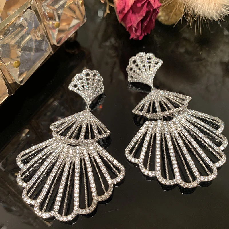 Fan-shaped earrings with a unique and exaggerated hollow design, slimming effect for round faces, elegant and stylishS925Silver