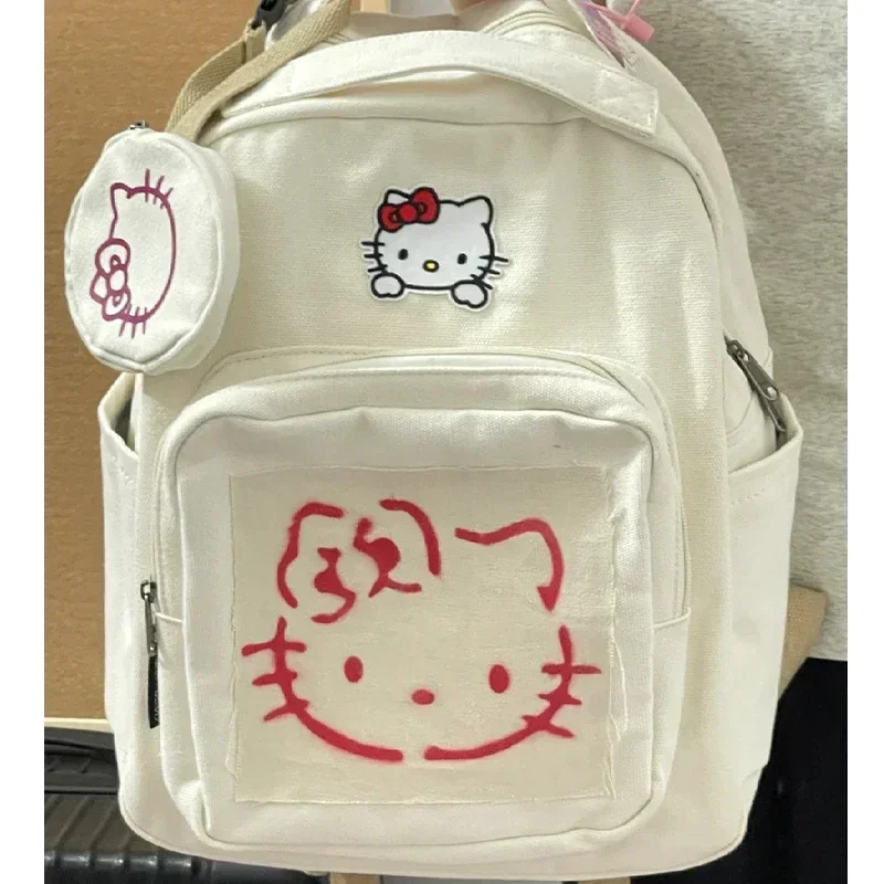 Sanrio กระเป๋าเป้สะพายหลัง Hello Kitty สำหรับผู้หญิงกระเป๋านักเรียนความจุมากของขวัญกระเป๋าเป้นักเรียนวิทยาลัยกระเป๋าเป้สะพายหลังสำหรับนักเรียนนักศึกษา