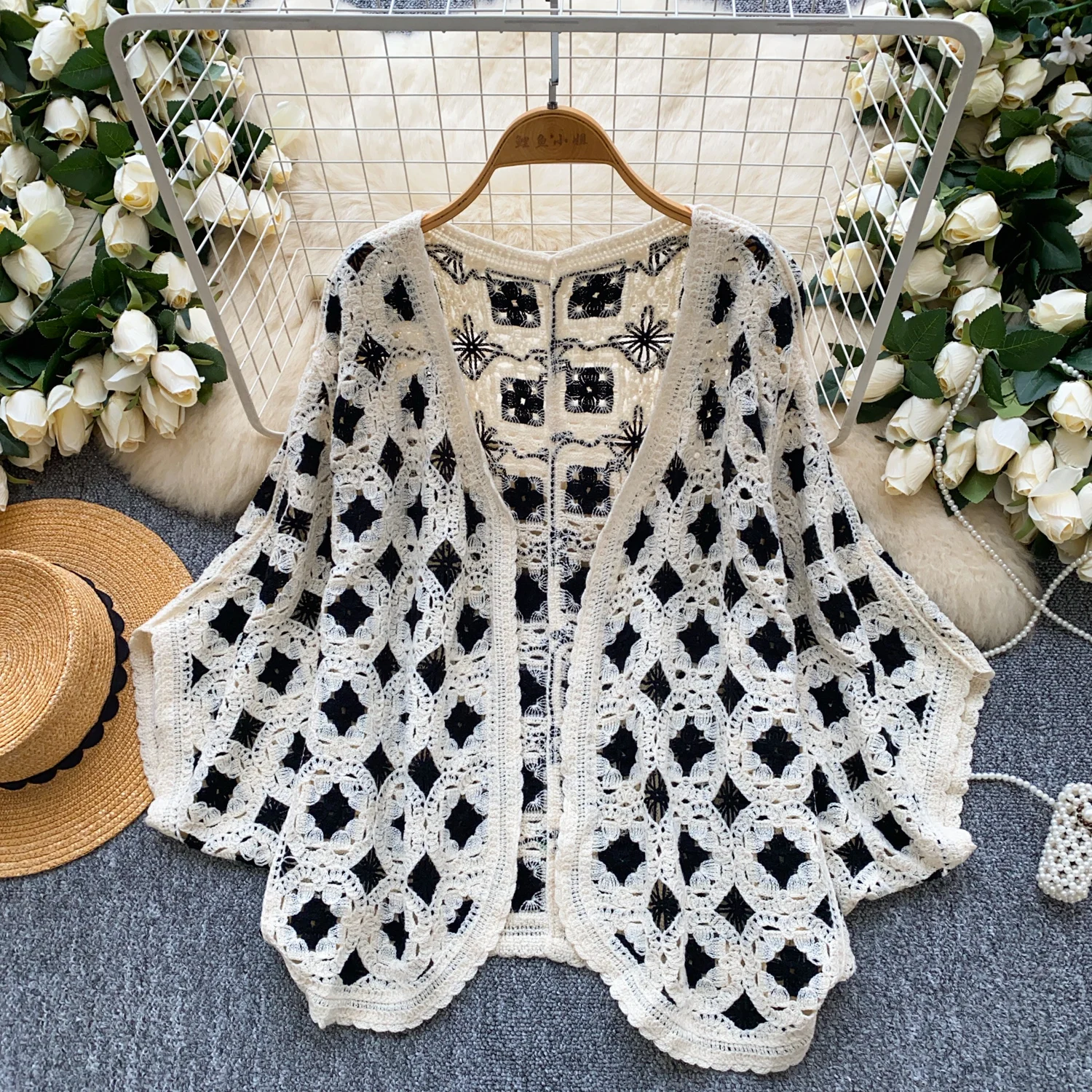 2025 primavera outono beira-mar férias malha cardigan feminino manga morcego solto boêmio oco crochê design proteção solar topo