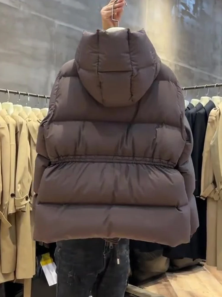   เสื้อโค้ทพัฟเฟอร์ผ้าฝ้ายมีฮู้ดสำหรับผู้หญิง รุ่นเกาหลี ทรงหลวม แขนยาว สไตล์เกาหลี รุ่นบางเบา เหมาะสำหรับฤดูหนาว