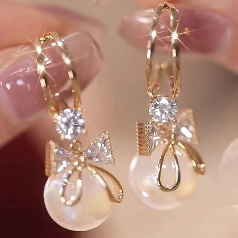 Pendientes con lazo de circonita para mujer, colgante de perlas redondas, Color dorado, forma de C, joyería elegante y delicada para fiesta, novedad