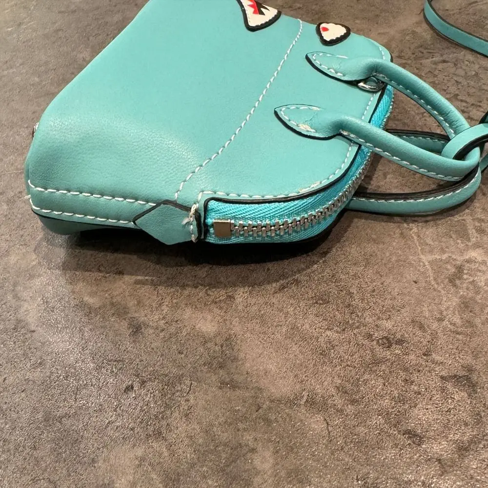 2025 الراقية حقيبة قلادة جلدية صغيرة مفتاح سلسلة الملحقات حقيبة أحمر الشفاه