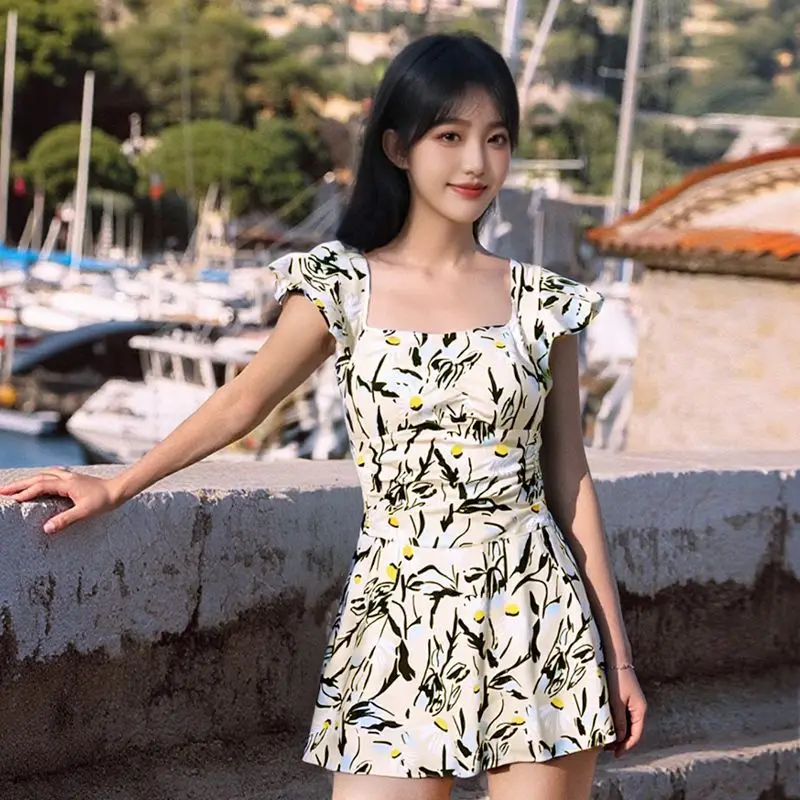 ชุดว่ายน้ำแฟชั่นเกาหลีสุดเซ็กซี่ ลายดอกไม้ระบาย ชุดว่ายน้ำวันพีซ ชุดเดรสสั้นจับจีบ ชุดบิกินี่แบบกางเกงขาสั้น ชุดว่ายน้ำเสริมฟองน้ำ ชุดว่ายน้ำแบบแทงกินี่