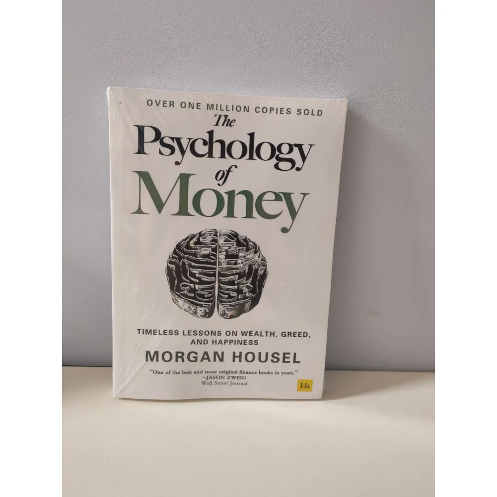 1 كتاب من تأليف مورغان هاوس علم النقود ونفس الكتاب على الإطلاق في غلاف ورقي باللغة الإنجليزية