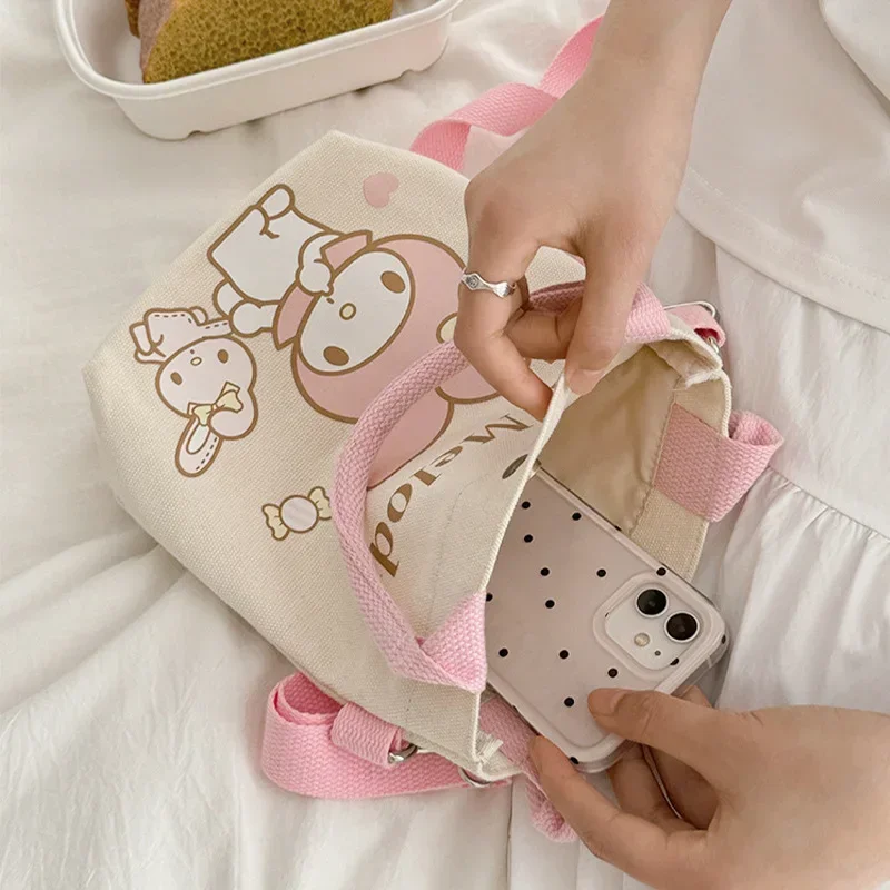 Sanrio Hello Kitty Cinnamoroll อนิเมะ Kawaii INS กระเป๋าผ้าใบแฟชั่นน่ารักเมโลดี้ท่องเที่ยวแบบสบายๆกระเป๋าถือใส่ของของขวัญของเล่น