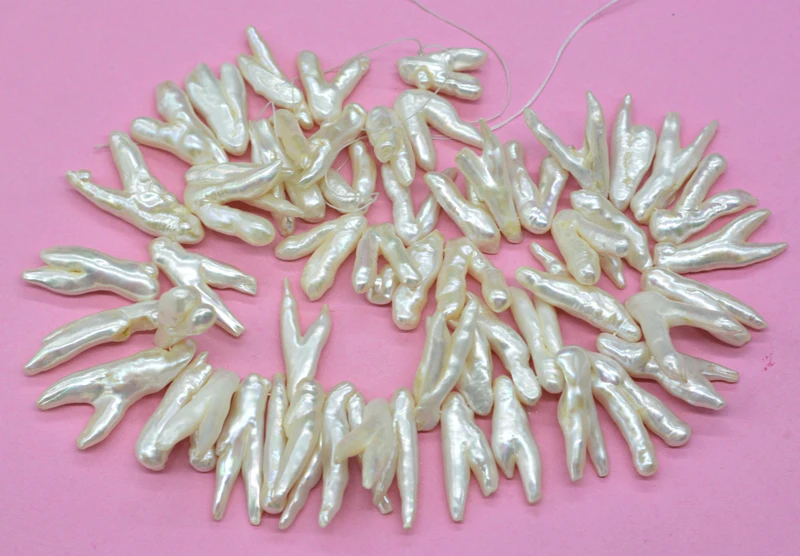 1 strand  chicken claw pearl, rare chicken claw shape, natural white irregular freshwater pearl. Scattered beads  15”