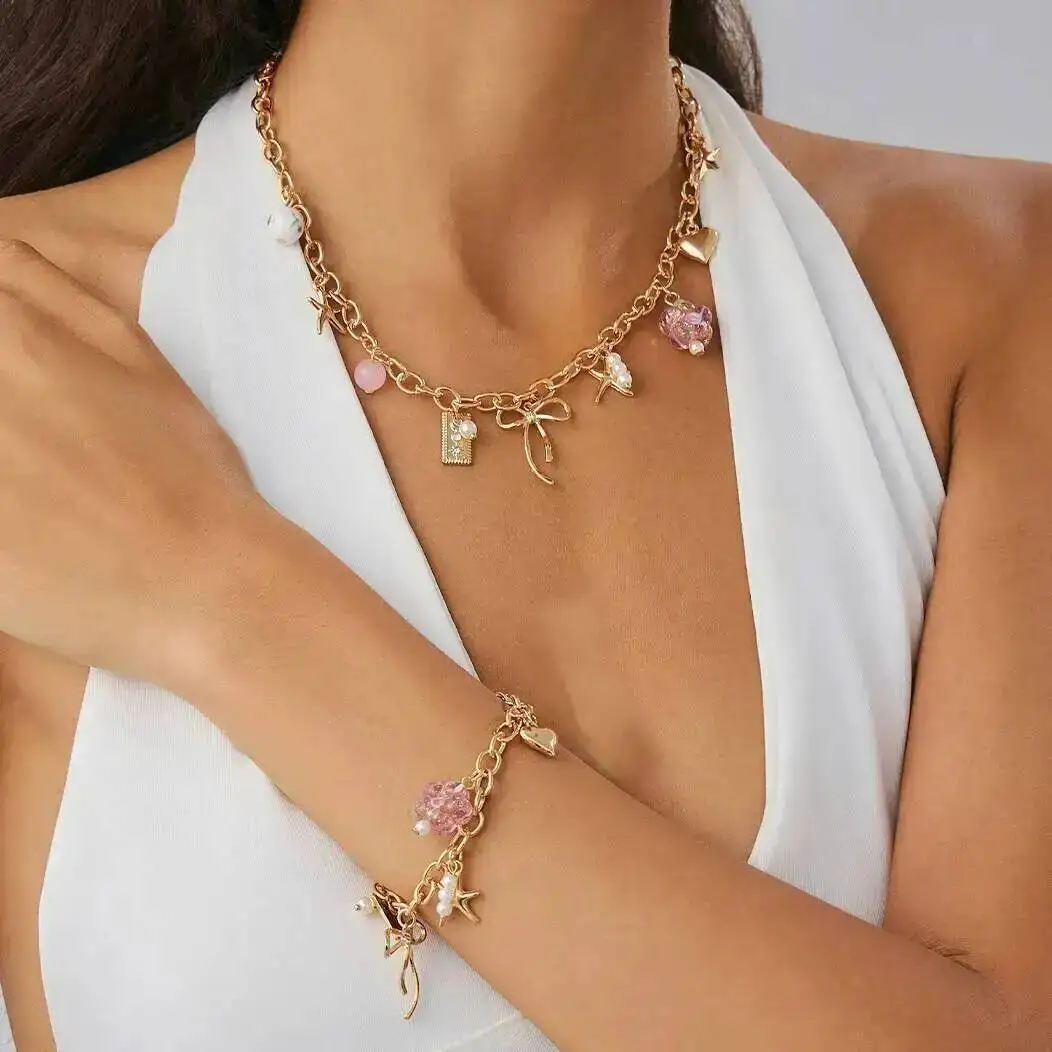 

KunJoe Cute Bowknot Acrylic Flower Pendant Choker Necklace Bracelet Jewelry Set for Women Sweet Gold Color Clavicle Chain Gift
