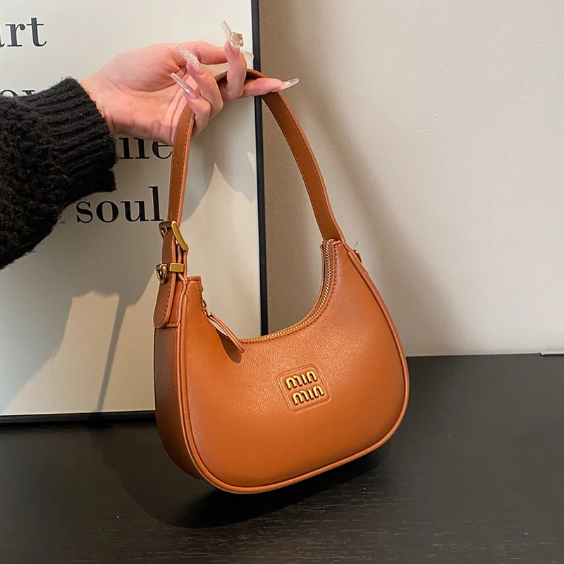 2025 new designer bags crescent-shaped bags, dumpling-shaped bags, commuter cross-body bags, hand-held bags over the shoulder