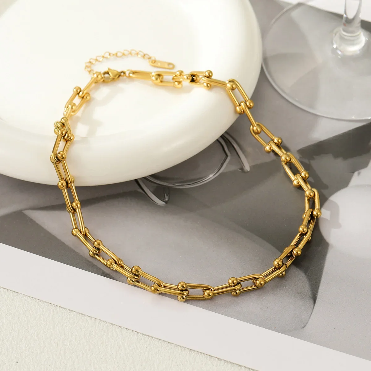 A stainless steel chain necklace suitable for office workers to wear on dates