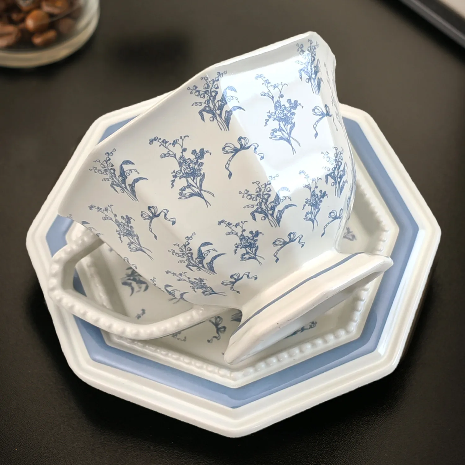 

Vintage French-style ceramic coffee cup and saucer set with high aesthetic value