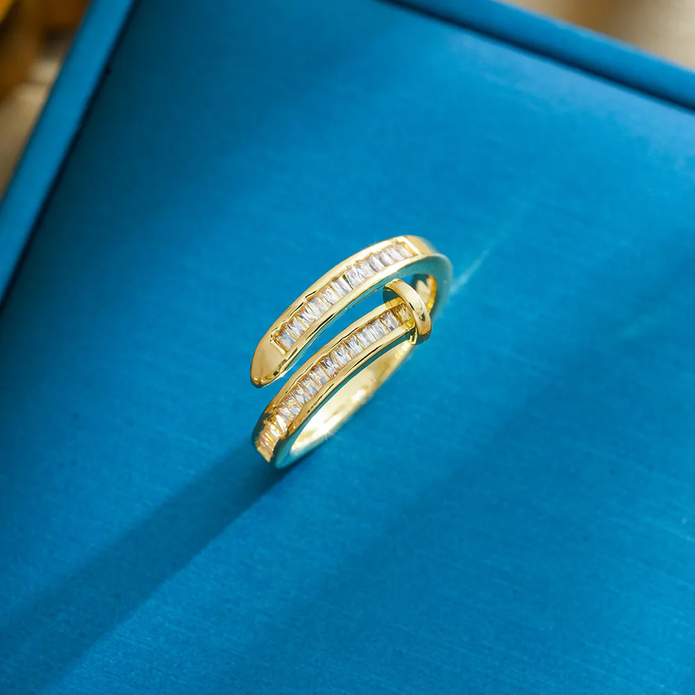 This is a latest unique, light luxury and niche design of a women's zircon ring with an open ring and a cool style.