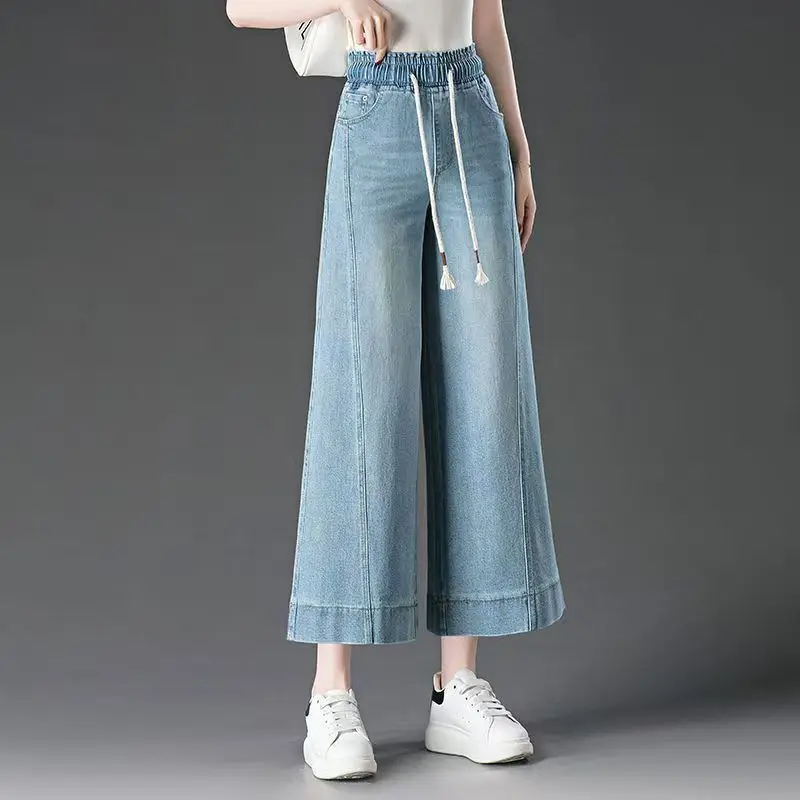 Spodnie damskie z wysokim stanem, szerokie nogawki, długość 7/8, elastyczna gumka w pasie, nowość na lato 2025, luźne, duże rozmiary, elastyczne jeansy.