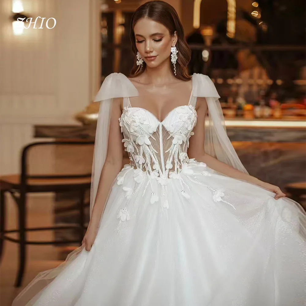 ZHIO Fiori eleganti Abito da sposa Fiocco senza spalline Corsetto Sweep Train Avorio Tulle Abito da sposa Abiti da sposa personalizzati