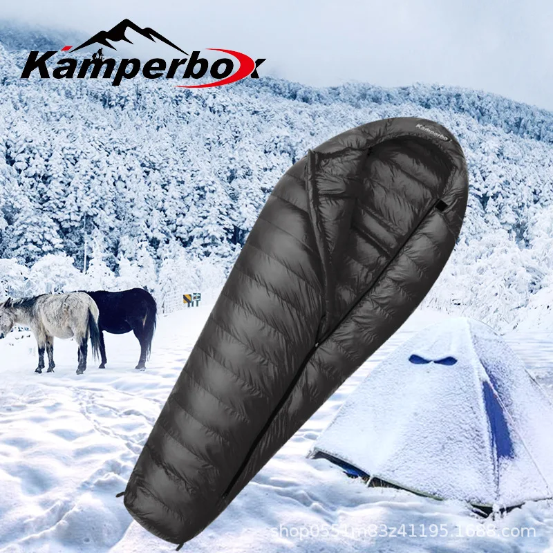 Outdoor sleeping bag for camping in winter, made of goose down, duck down and cotton, providing extra warmth and insulation.