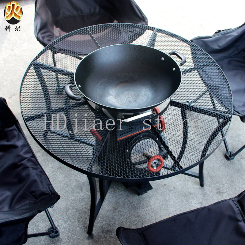 Kehong wood-burning stove, paired with a carbon steel black round table, makes courtyard pot an extremely enjoyable experience.