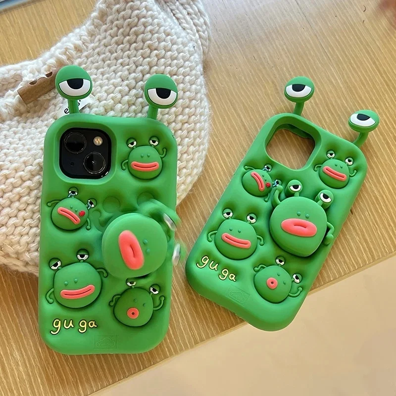 Cartoon silicone telescopic rotating ugly green frog phone case, suitable for iPhone 13/14/15/16/17 Pro Max back cover.