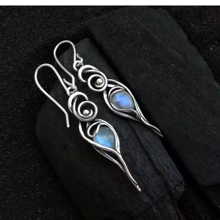 Elegant swirling vortex pattern drop-shaped artificial gemstone earrings for ladies, suitable for parties and gatherings.